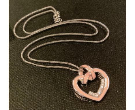 An enamelled 18ct white gold diamond heart pendant necklace, pink enamelled heart set with eight round brilliant cut diamonds