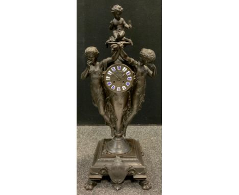 A French figural spelter clock,  the 11.5cm dial with blue enamelled  Roman numerals on a white cartouche, twin winding holes