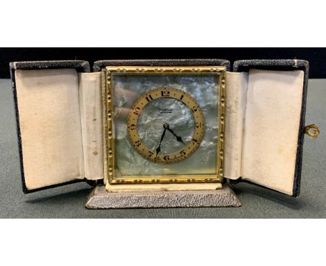A Mappin gilt metal easel travel clock, gilt chapter ring, Arabic numerals, on a faux mother-of-pearl ground, 6.5cm, cased 