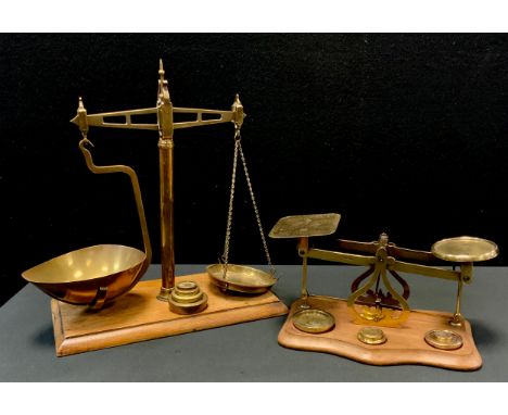 A pair of 19th century brass and mahogany balance scales, rectangular base, 37cm high, c.1880; a set of Victorian postal scal