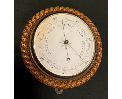 A Victorian oak circular barometer, carved rope twist border, 27cm diam, c.1880 
