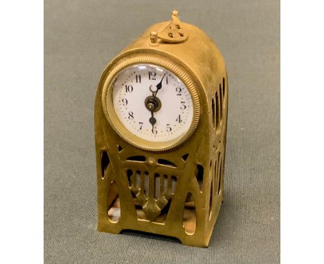 A German Art Nouveau brass travelling clock, pierced with tendrils and strap work, 9.5cm high, c.1910 