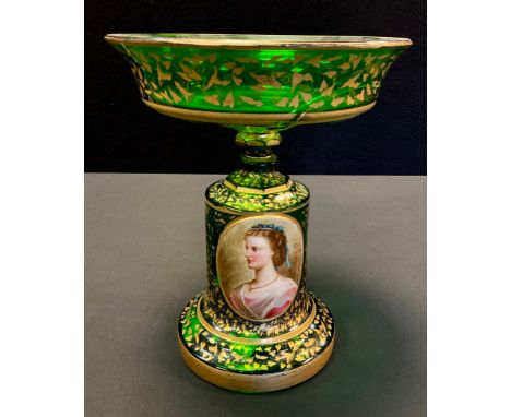 A Bohemian emerald green glass comport, the cylindrical stand with painted oval portrait, decorated overall with gilt foliage