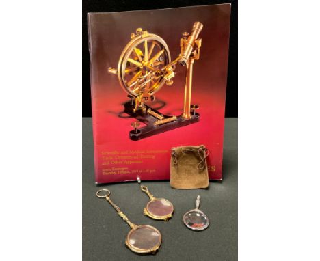 A pair of 19th century gilt metal lorgnette, the haft with gold salamander, 15cm long, Christies 3rd March 1994, Lot 163;  a 