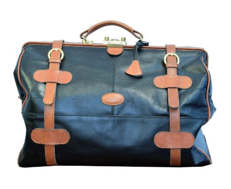 A vintage Bugatti leather luggage bag, the black and tan smooth leather exterior with gold tone hardware, dimensions 48 x 27 