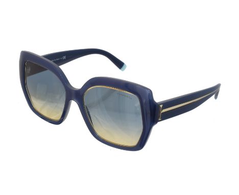 A pair of Tiffany &amp; Co 'Opal Blue' sunglasses, the blue frames with yellow and blue gradient shades and maker's T detaili