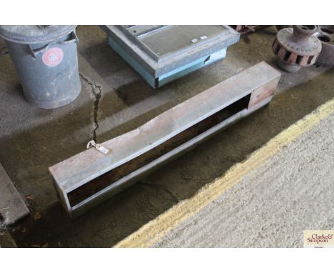 A galvanised wall hanging feeder / planter