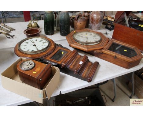 An oak octagonal faced wall clock, a rosewood inlaid wall clock and a small wall clock - all AF and sold as seen