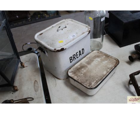 An enamel bread bin and a small enamel container with lid