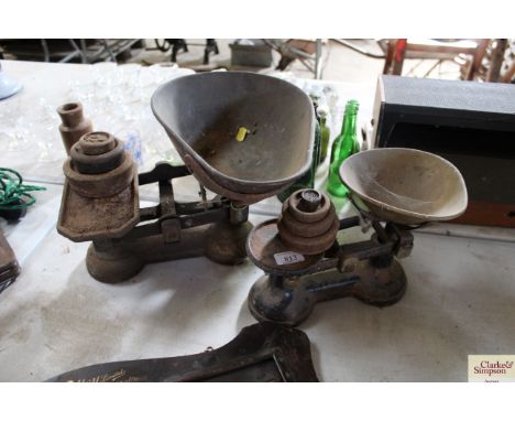 Two vintage sets of scales and weights