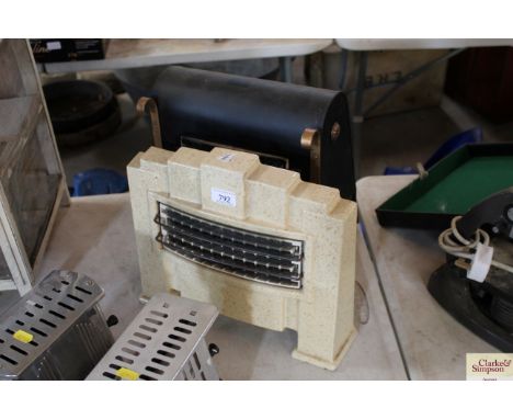 A 1950's electric heater - sold as a collector's item and an enamel Art Deco style bedroom fire - sold as a collector's item