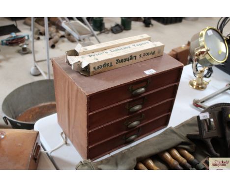 A small set of Finsbury office drawers and three boxes of Prices lighting tapers