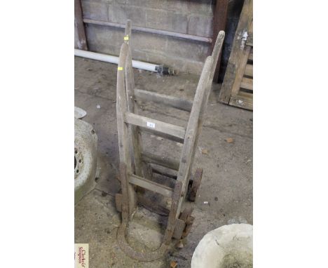 Two vintage wooden sack barrows