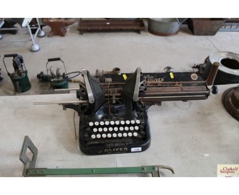 An Oliver Batwing typewriter, supplied by the Cosmos Typewriter Co. Queen Victorian Street, London AF