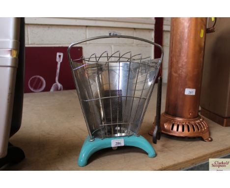 A small enamel and metal vintage Calor Gas heater complete with Calor Gas spanner