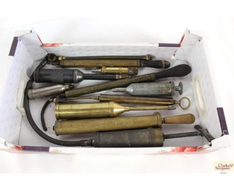 A collection of various vintage grease guns