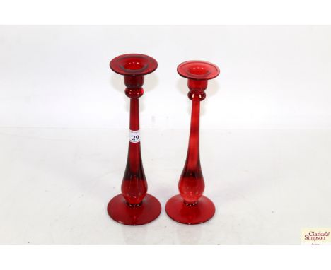 Two ruby glass candlesticks
