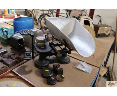 A set of shop keepers scales with a set of Lincoln weights and various other scale weights