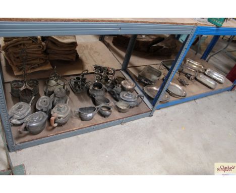 A large quantity of vintage plated ware to include tea pots, cruets, plated dishes etc.