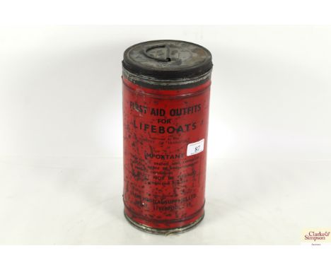 A vintage "First Aid Outfit for Lifeboats" in tin cannister