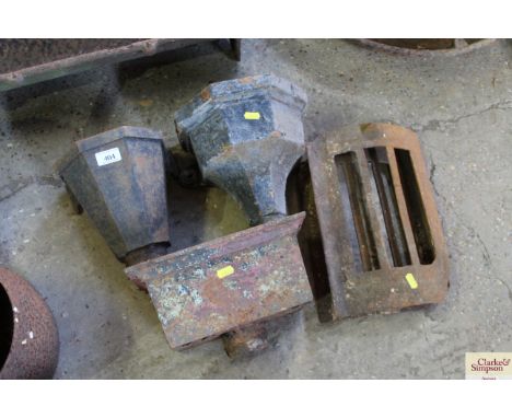 Three cast iron rain hoppers and two iron tile frames
