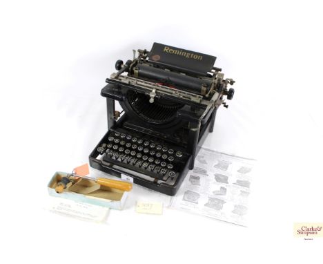 A vintage Remington typewriter and a Parker Roller Typek cleaner
