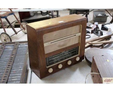 A vintage Etronic radio in wooden case