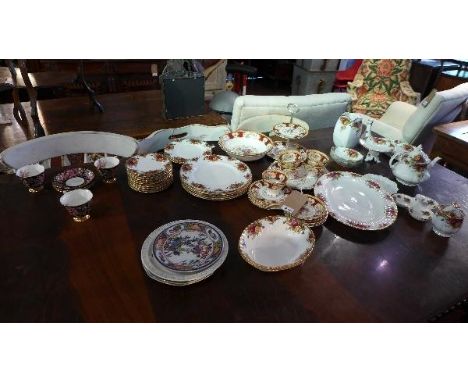 A collection of porcelain, to include a Royal Albert part dinner service comprising cake stand, saucers, side plates, five te