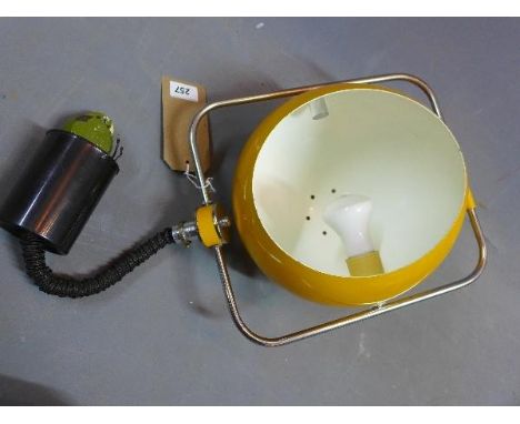A 1970's yellow enamelled rise and fall ceiling light, with chrome frame 