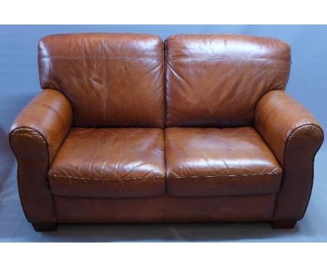 A Contemporary tan leather two seater sofa 