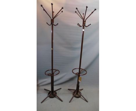 A pair of mid 20th century brown steel coat and stick stands 