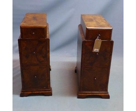 A pair of Art Deco burr walnut pedestal chests, with three drawers, raised on bracket feet, H.71 W.31 D.56cm 