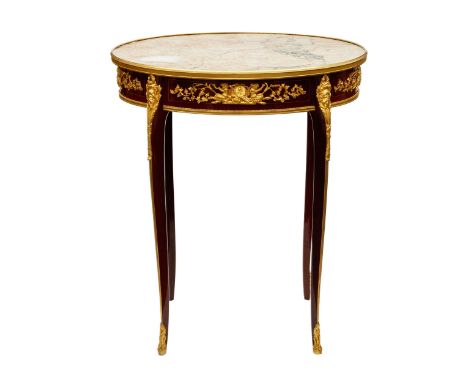 Magnificent mahogany and gilded bronze boudoir table under an oval Louis XVI style marble top by Francois Linke (1855-1946). 