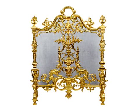 Fireplace screen Louis XVI style. Made of hammered and gilded bronze. 20th century. It has an arched top topped with a handle