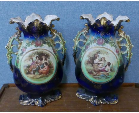 A desk top terrestrial globe and a pair of Celtic porcelain two handled vases 