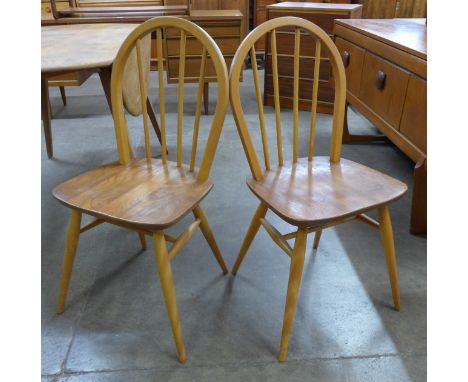 A pair of Ercol elm and beech Windsor chairs 