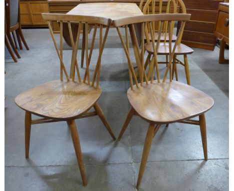 A pair of Ercol elm and beech 376 model candlestick chairs 