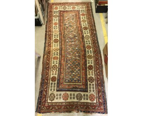 A Talish runner, the central panel set with repeating multi-coloured design on a pale blue ground within a stepped pink, crea