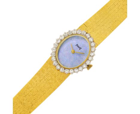 18 kt., mechanical, oval numberless opal dial, 27 round diamonds ap. 1.90 cts., case dia. ap. 29.3 x 25 mm., articulated bar 
