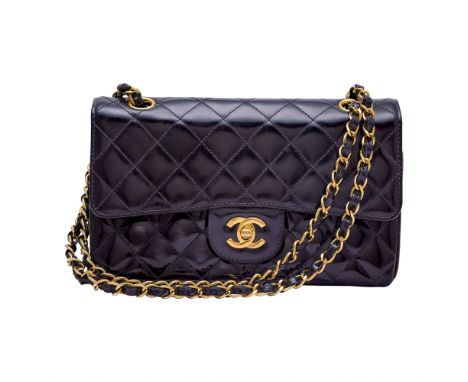 Double flap bag with gold-tone hardware, double 'CC' turn lock closure and woven-in leather chain strap, interior with three 