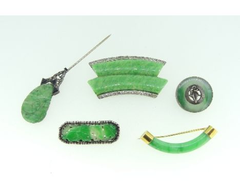 A collection of Oriental Brooches, a hatpin and pendants, one in lavender jade, the others mottled green, together with a car