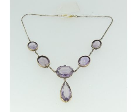 An attractive amethyst Necklace, formed of five collet set facetted oval stones, the centre with tear drop shaped stone suspe