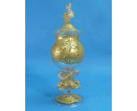 A Salviati Murano glass vase and cover, the globular bowl supported by three mythological fish on a domed circular foot, the 