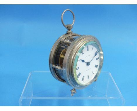 A rare and unusual circular fusee carriage type travelling clock, in silvered metal drumhead case with glazed pillared sides,