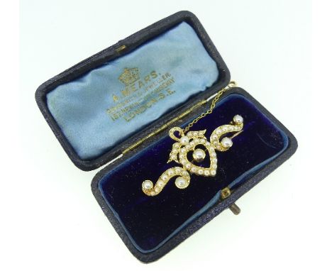 An attractive Bar Brooch, formed of an open heart with bow above, with scrolls on each shoulder, all set with seed pearls, al