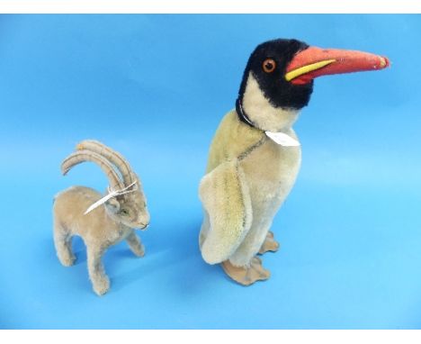 A vintage Steiff 'Peggy' Penguin, circa 1950's, raised lettering nickel button having had yellow label cut out, 13in (33cm) h