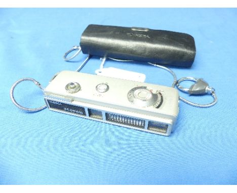 A Yashica Atoron miniature pocket Camera, in original case, 4in (10cm) long.