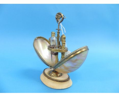 A late 19thC French 'Palais Royale' shell mounted Etui, the egg shaped case formed of two mother of pearl shells, the two hal