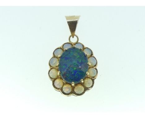 An oval shaped Pendant, set in the centre with an opal doublet, cracked, surrounded by twelve small opals, all mounted in yel