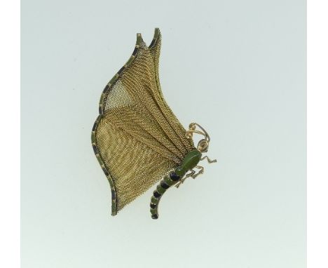 An unusual Butterfly Brooch, formed of gilt mesh wings, the body and wing tips with green and black enamel, marked on the pin